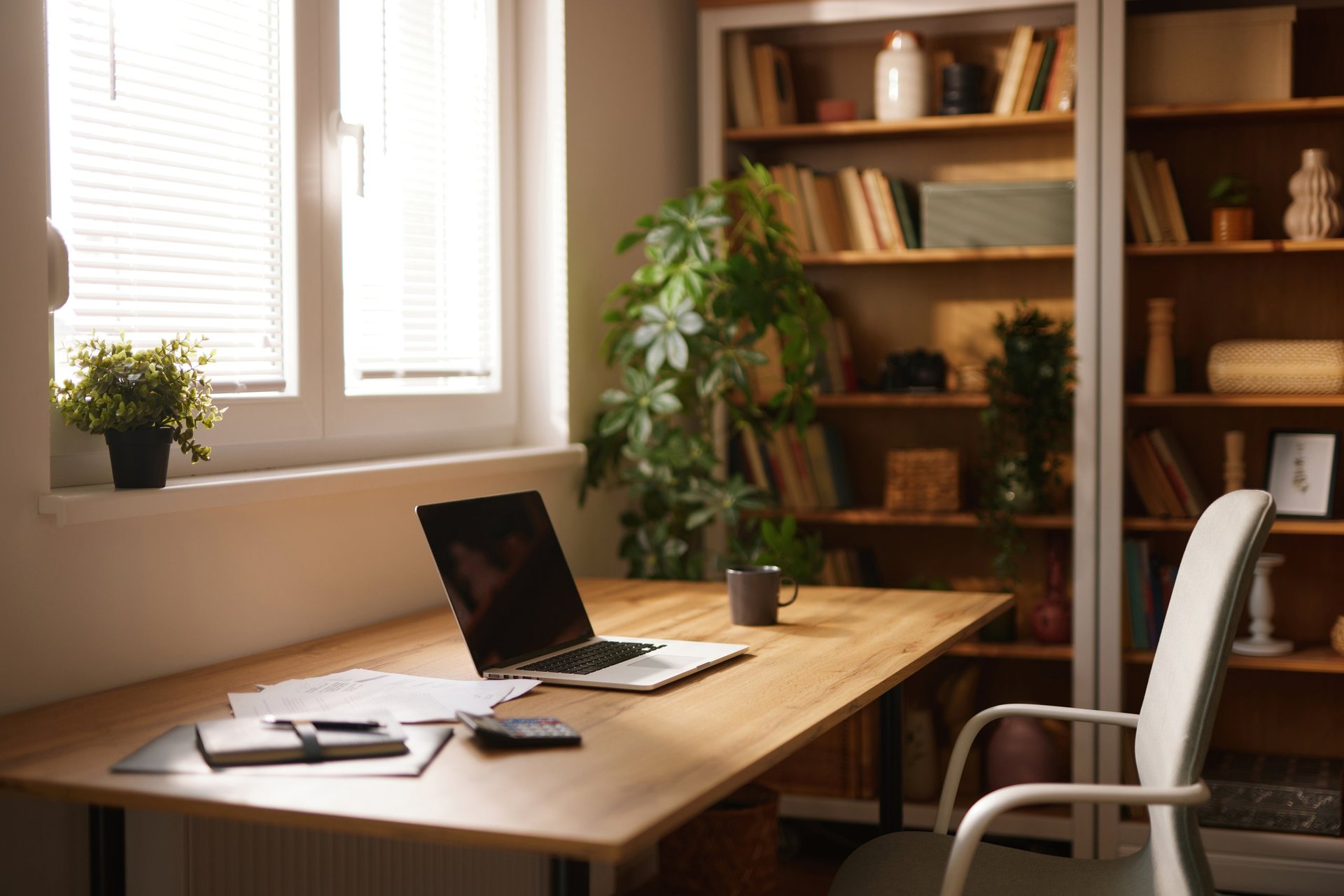 Modern home office with laptop and documents